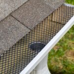 Installing,Gutter,Guard,Mesh,Screen,On,Rain,Guttering.,Home,Maintenance,
