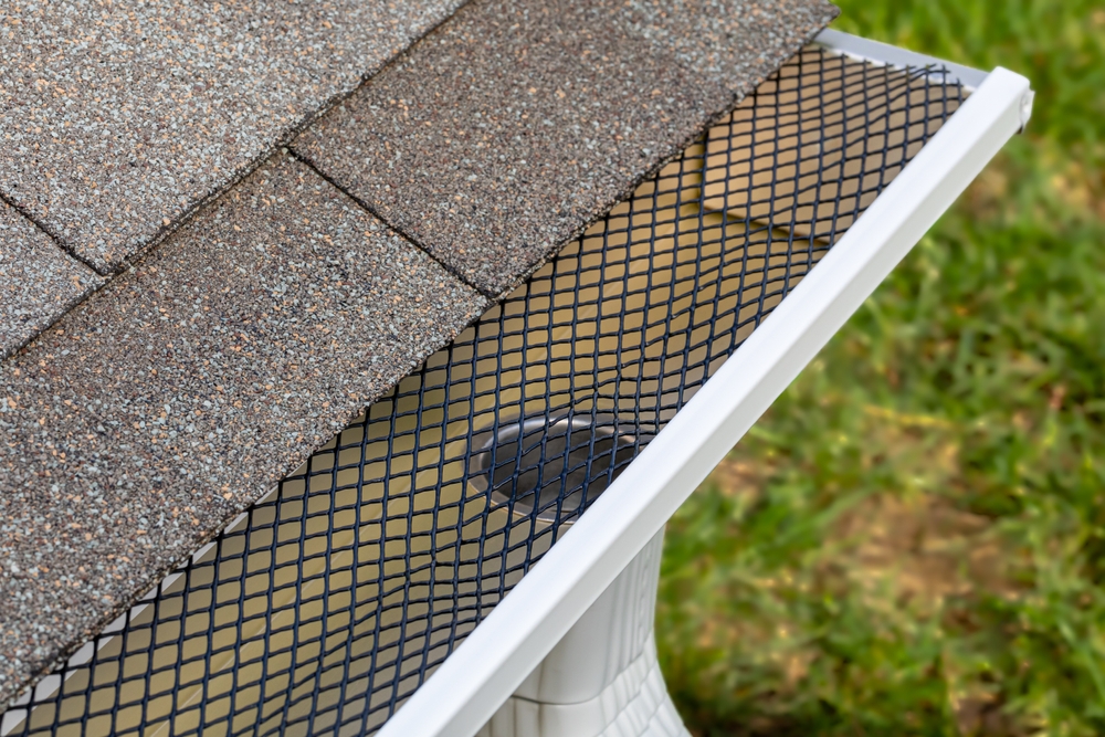 Installing,Gutter,Guard,Mesh,Screen,On,Rain,Guttering.,Home,Maintenance,