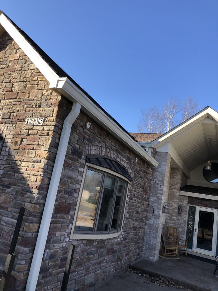 brick house with gutters